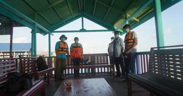 Taking photo with apparatus from Desa Ujir before departing