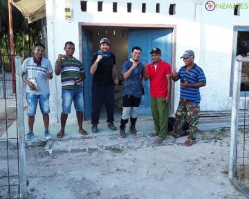 NZMATES team, Bappeda staff and Eliasa village government staff in front of the power house after checking the solar plant.