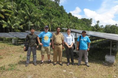 NZMATES technical and community engagement team with Pulau Kur sub district head (Camat) at the solar PV installation in Lokwirin village